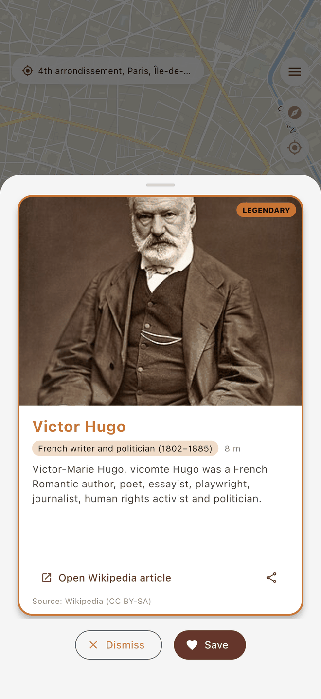A discovery card open on the map, showing a historical figure who lived at this spot.